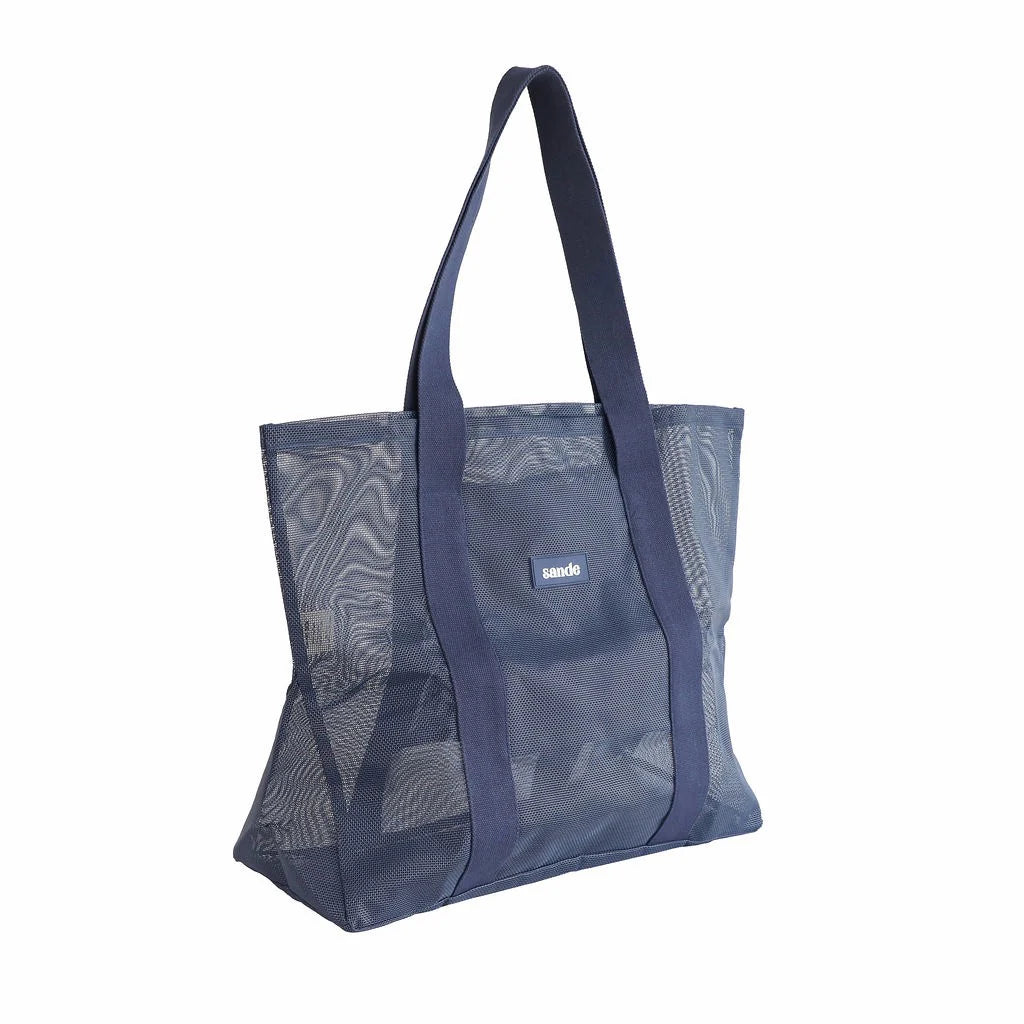 Side image of sand kids beach bag mini in deep sea. Studio image.