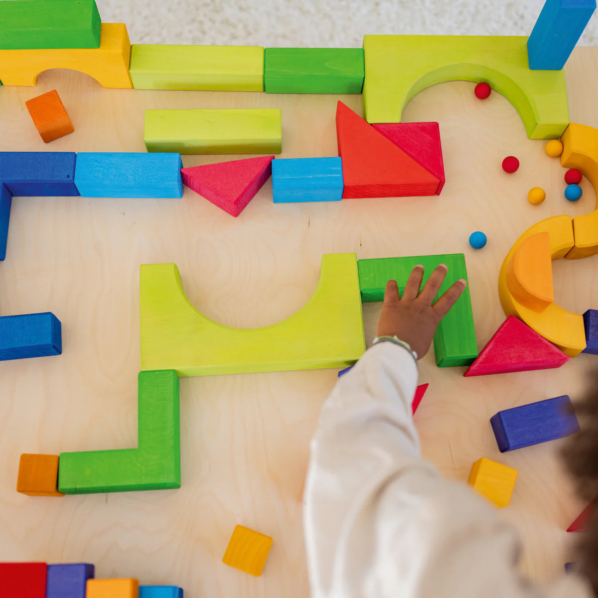 Create, stack and build with Grimm's Basic Building Set. A 30-piece wooden block set designed to inspire imaginative, open-ended play from an early age.