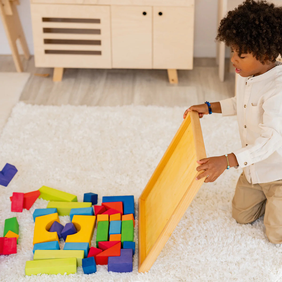 Create, stack and build with Grimm's Basic Building Set. A 30-piece wooden block set designed to inspire imaginative, open-ended play from an early age.