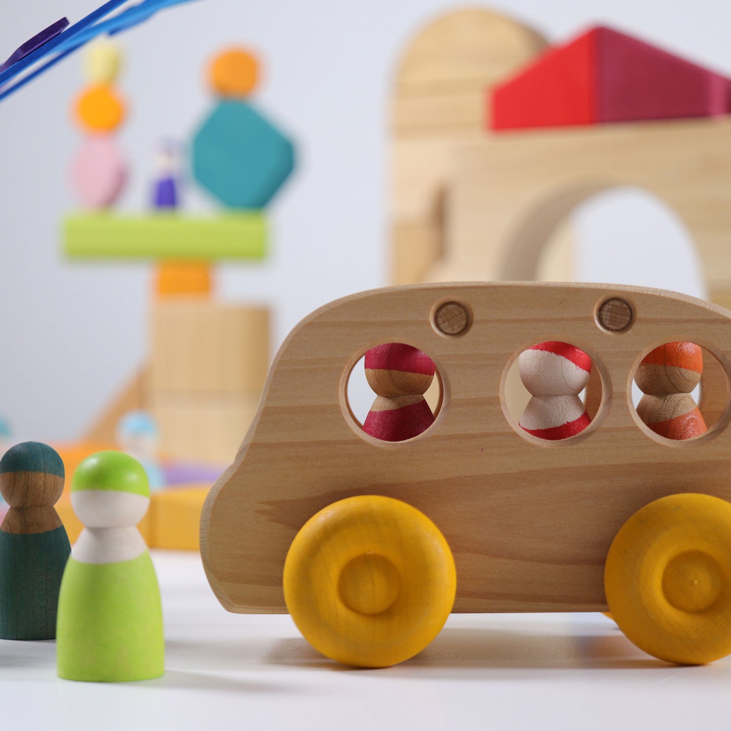 Grimm's Wooden Bus made from natural alder wood for imaginative open-ended play.
