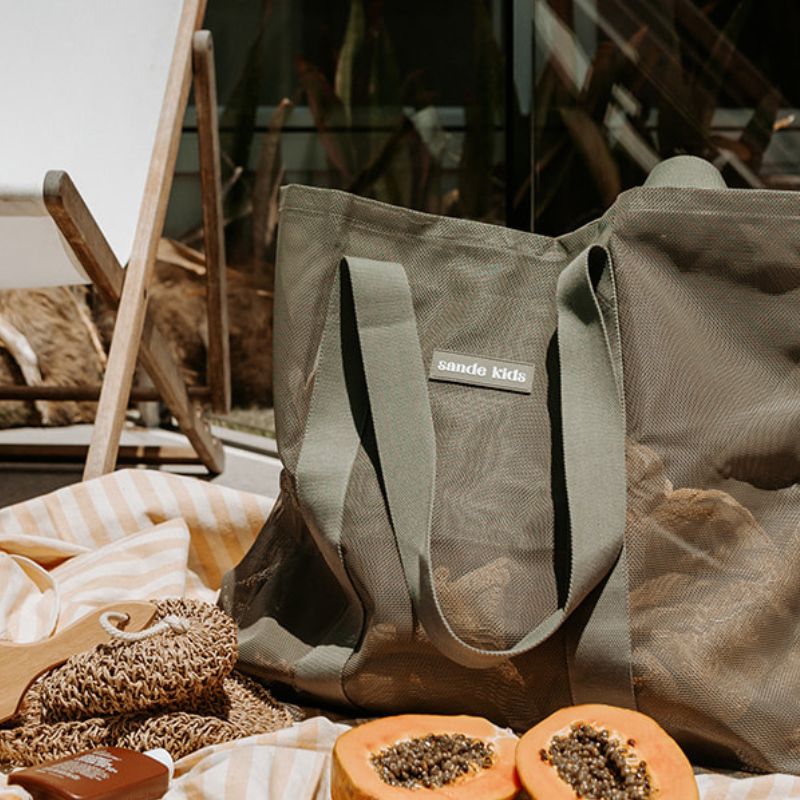 Large Mesh beach hauler bag at a picnic setting.