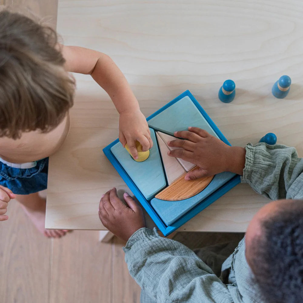 Grimm's Blue Building Set with large blue wooden blocks for creative building and open-ended imaginative play.
