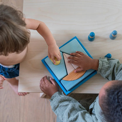 Grimm's Blue Building Set with large blue wooden blocks for creative building and open-ended imaginative play.