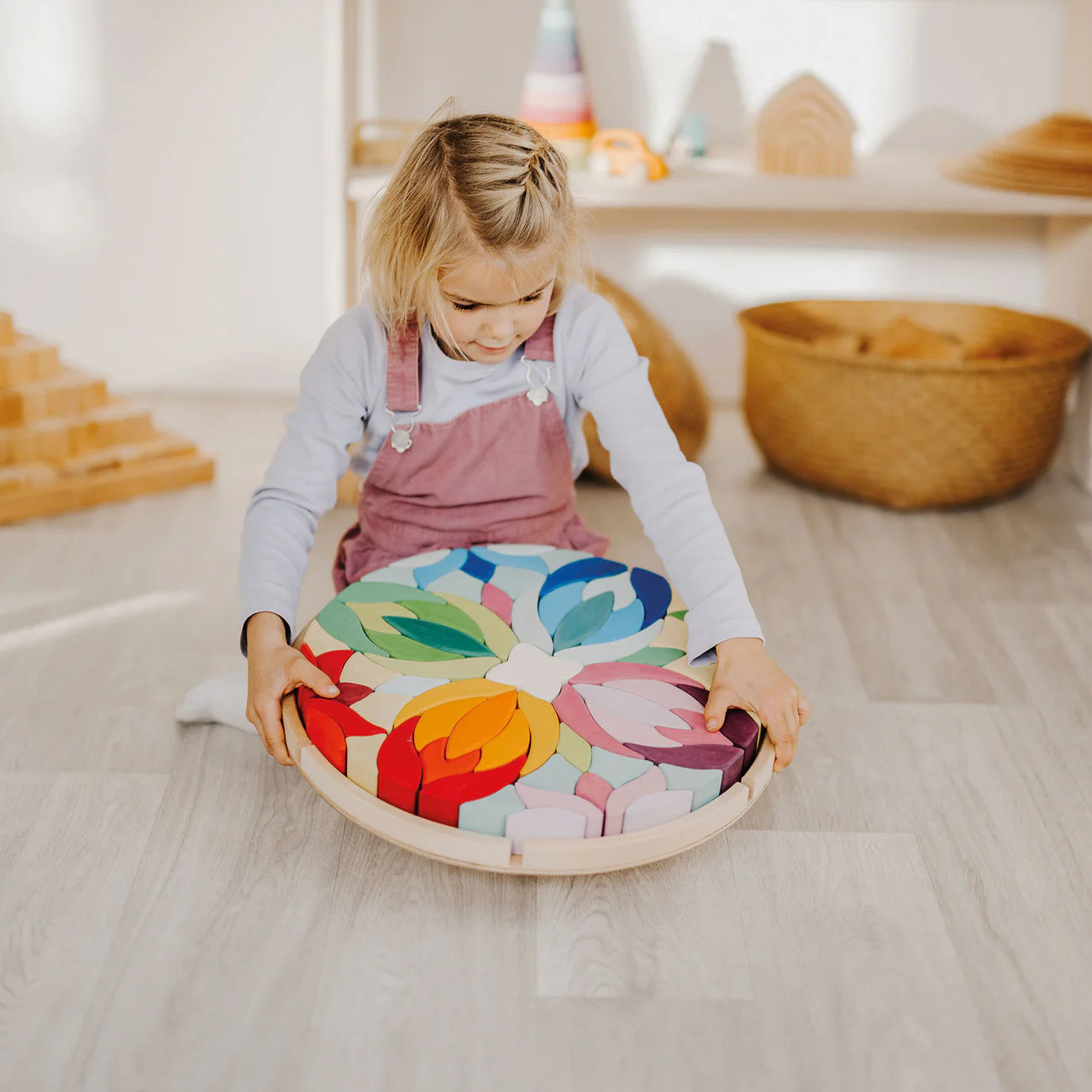 Grimm's Building Set Lara with 73 colourful curved wooden blocks for imaginative building and open-ended play.