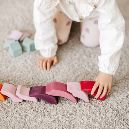 Grimm's Building Set Lara with 73 colourful curved wooden blocks for imaginative building and open-ended play.