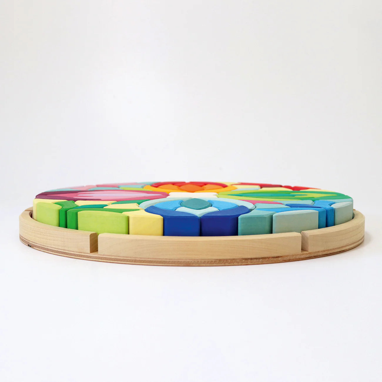 Grimm's Building Set Lara with 73 colourful curved wooden blocks for imaginative building and open-ended play.