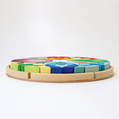 Grimm's Building Set Lara with 73 colourful curved wooden blocks for imaginative building and open-ended play.