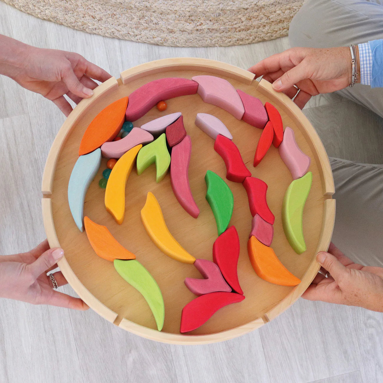 Grimm's Building Set Lara with 73 colourful curved wooden blocks for imaginative building and open-ended play.