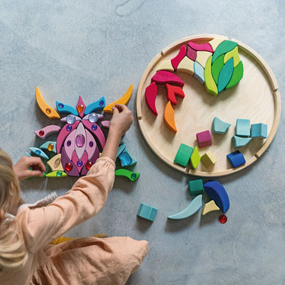 Grimm's Building Set Lara with 73 colourful curved wooden blocks for imaginative building and open-ended play.
