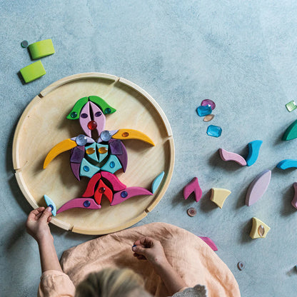 Grimm's Building Set Lara with 73 colourful curved wooden blocks for imaginative building and open-ended play.