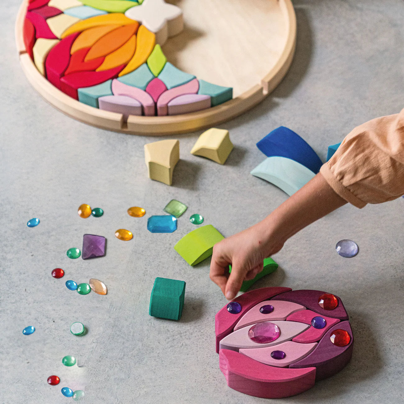 Grimm's Building Set Lara with 73 colourful curved wooden blocks for imaginative building and open-ended play.