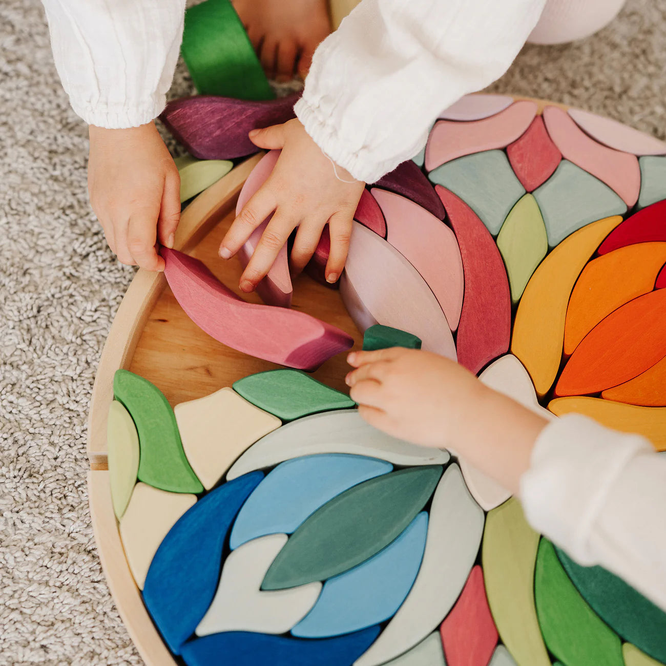 Grimm's Building Set Lara with 73 colourful curved wooden blocks for imaginative building and open-ended play.
