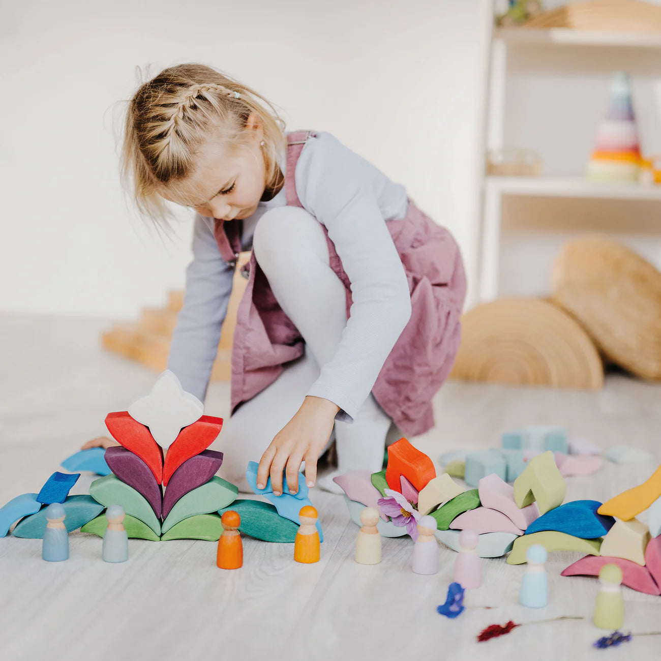 Grimm's Building Set Lara with 73 colourful curved wooden blocks for imaginative building and open-ended play.