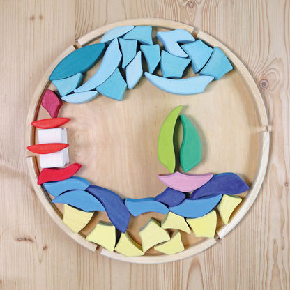 Grimm's Building Set Lara with 73 colourful curved wooden blocks for imaginative building and open-ended play.