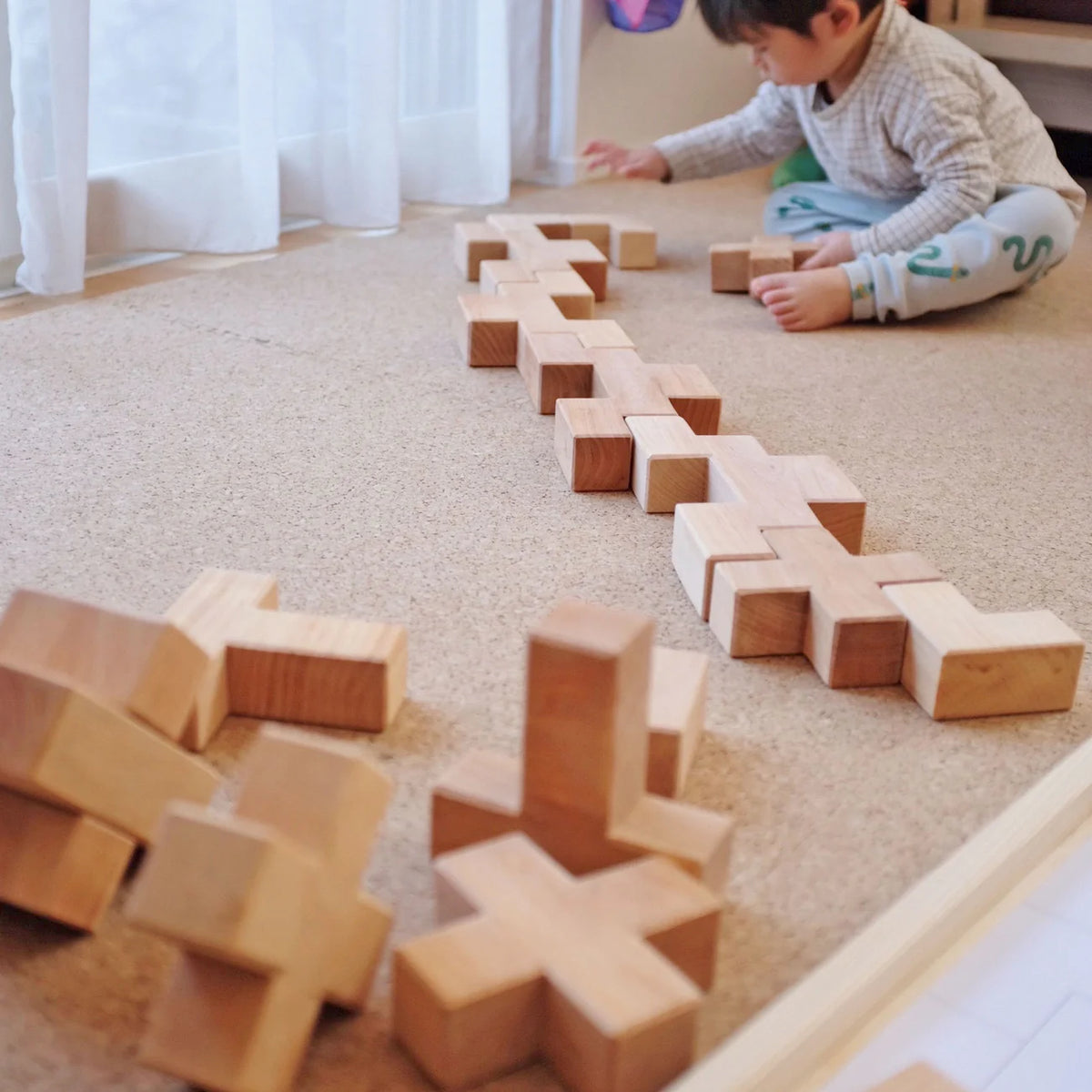 Grimm's Building Set Stairway with 19 natural alder wood building blocks for imaginative open-ended play.