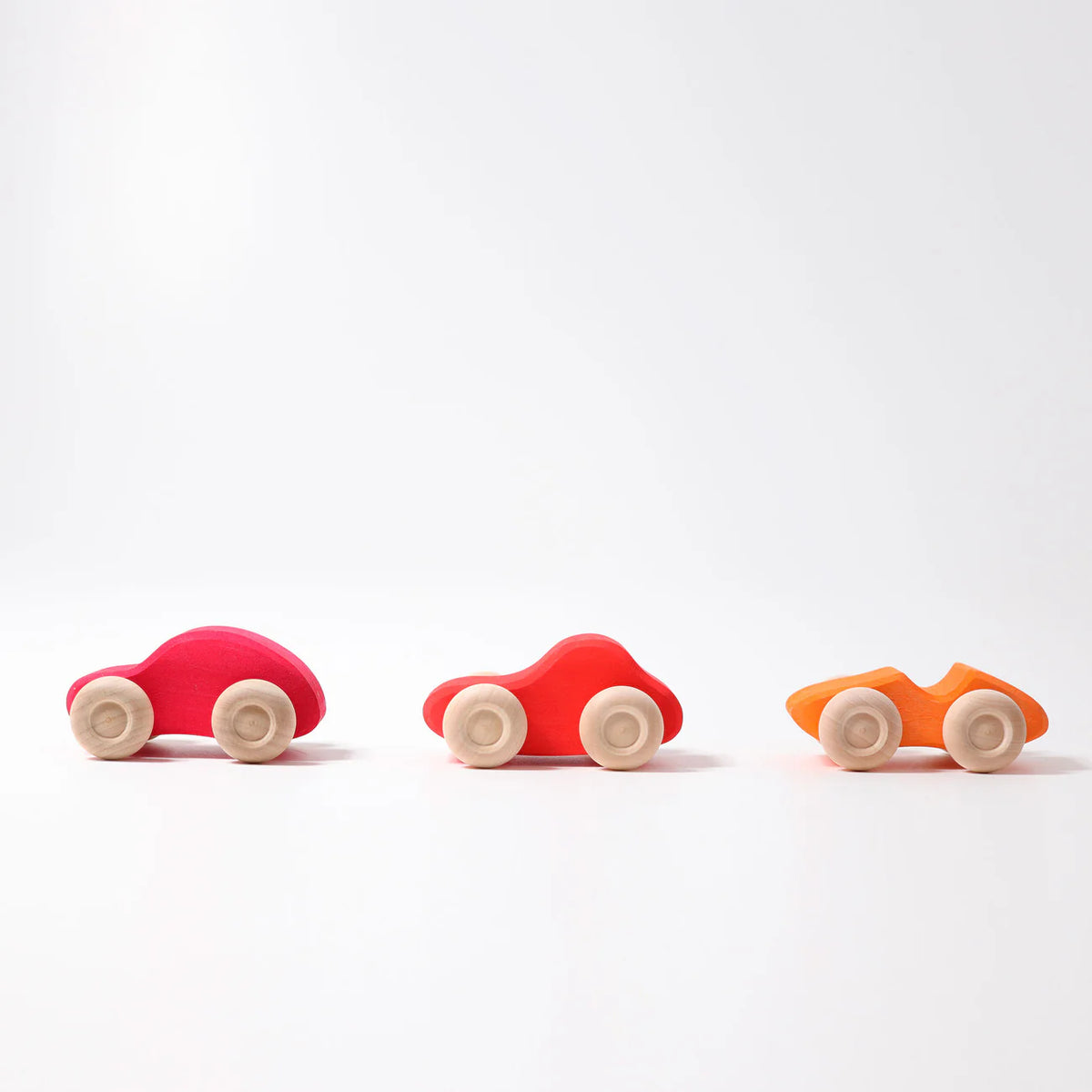 Grimm's Coloured Wooden Cars set of six handcrafted wooden vehicles for imaginative open-ended play.