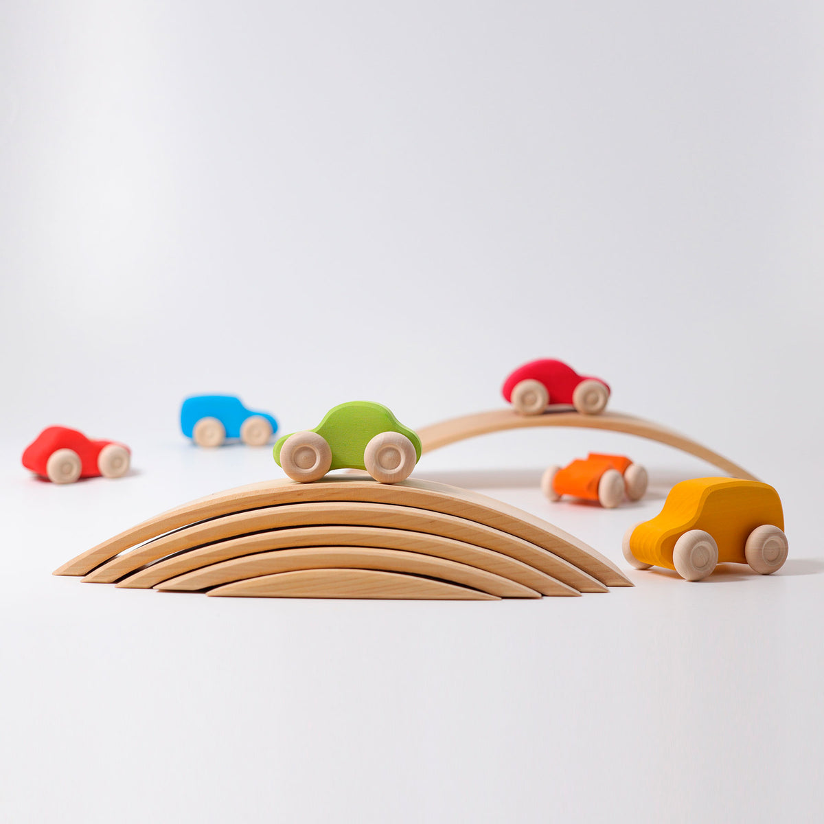 Grimm's Coloured Wooden Cars set of six handcrafted wooden vehicles for imaginative open-ended play.