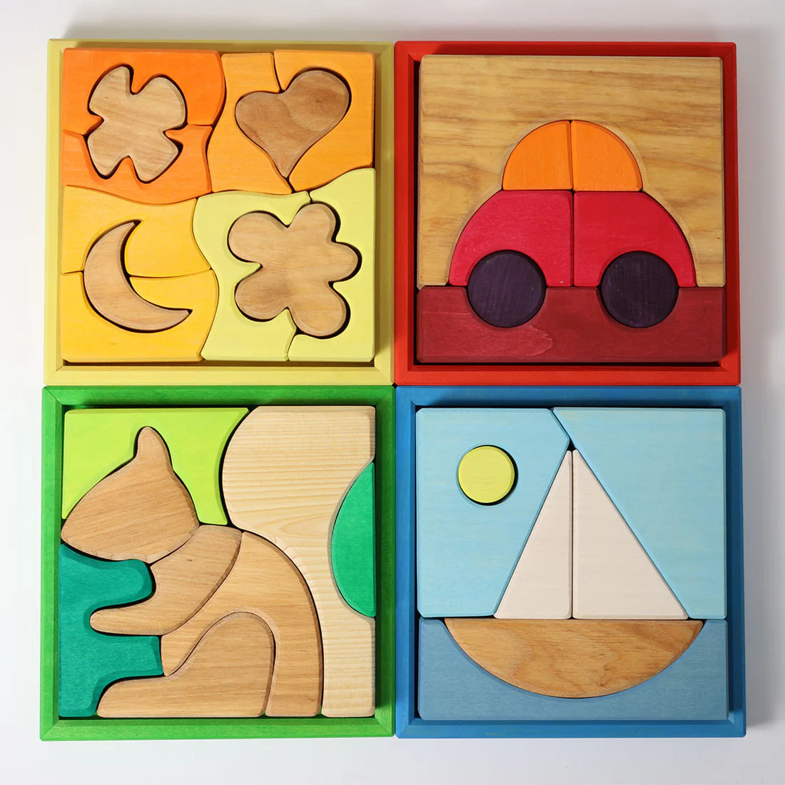 Grimm's Red Building Set with large red wooden blocks for creative building and open-ended imaginative play.