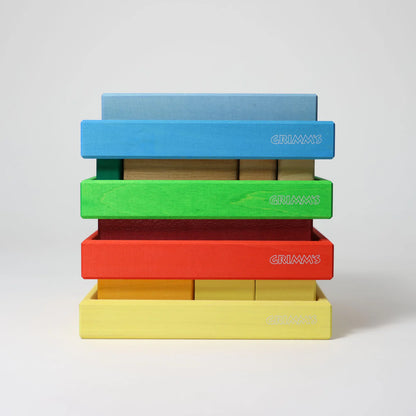 Grimm's Red Building Set with large red wooden blocks for creative building and open-ended imaginative play.