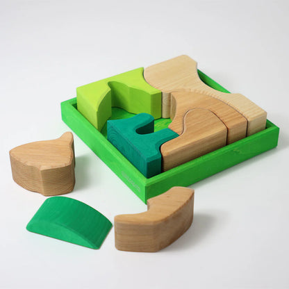Grimm's Green Building Set with large green wooden blocks for creative, open-ended building and imaginative play.