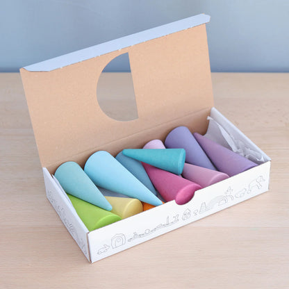 Grimm's Pastel Forest featuring 12 handcrafted wooden trees in soft pastel colours for small world play, imaginative storytelling and open-ended learning.