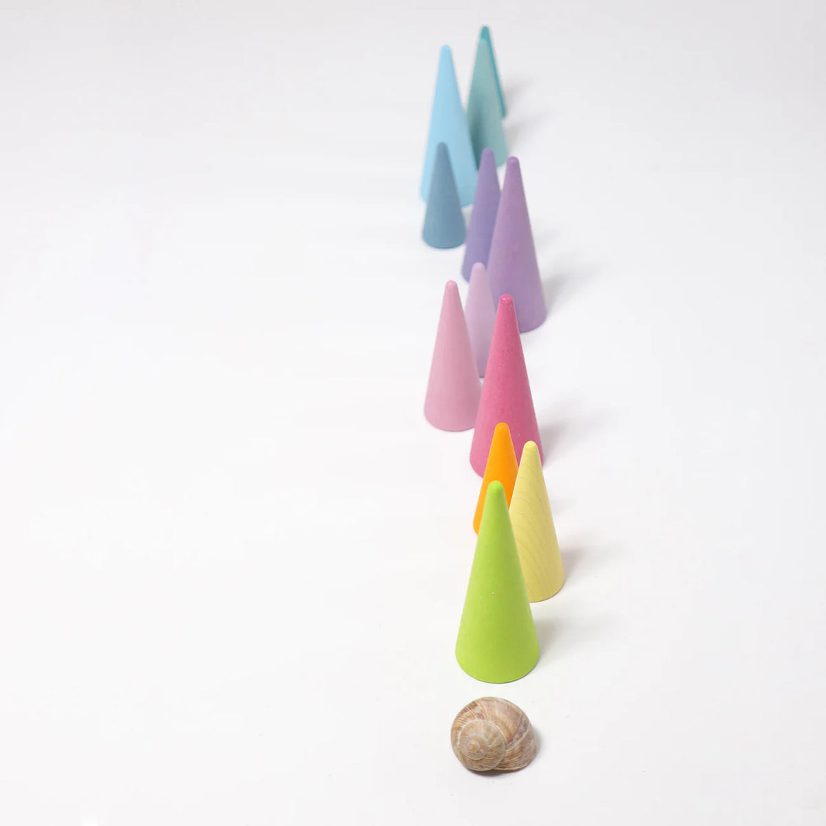 Grimm's Pastel Forest featuring 12 handcrafted wooden trees in soft pastel colours for small world play, imaginative storytelling and open-ended learning.