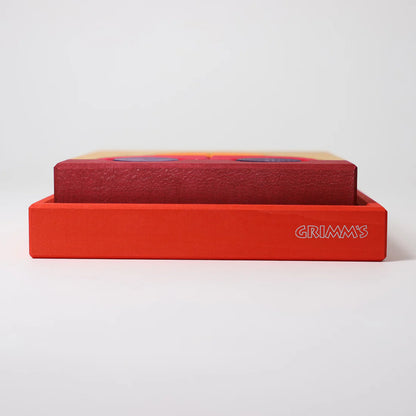 Grimm's Red Building Set with large red wooden blocks for creative building and open-ended imaginative play.