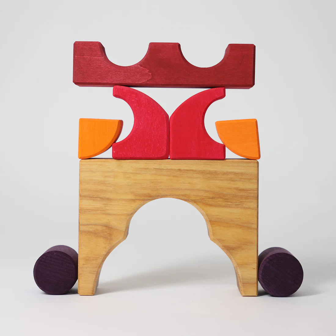 Grimm's Red Building Set with large red wooden blocks for creative building and open-ended imaginative play.