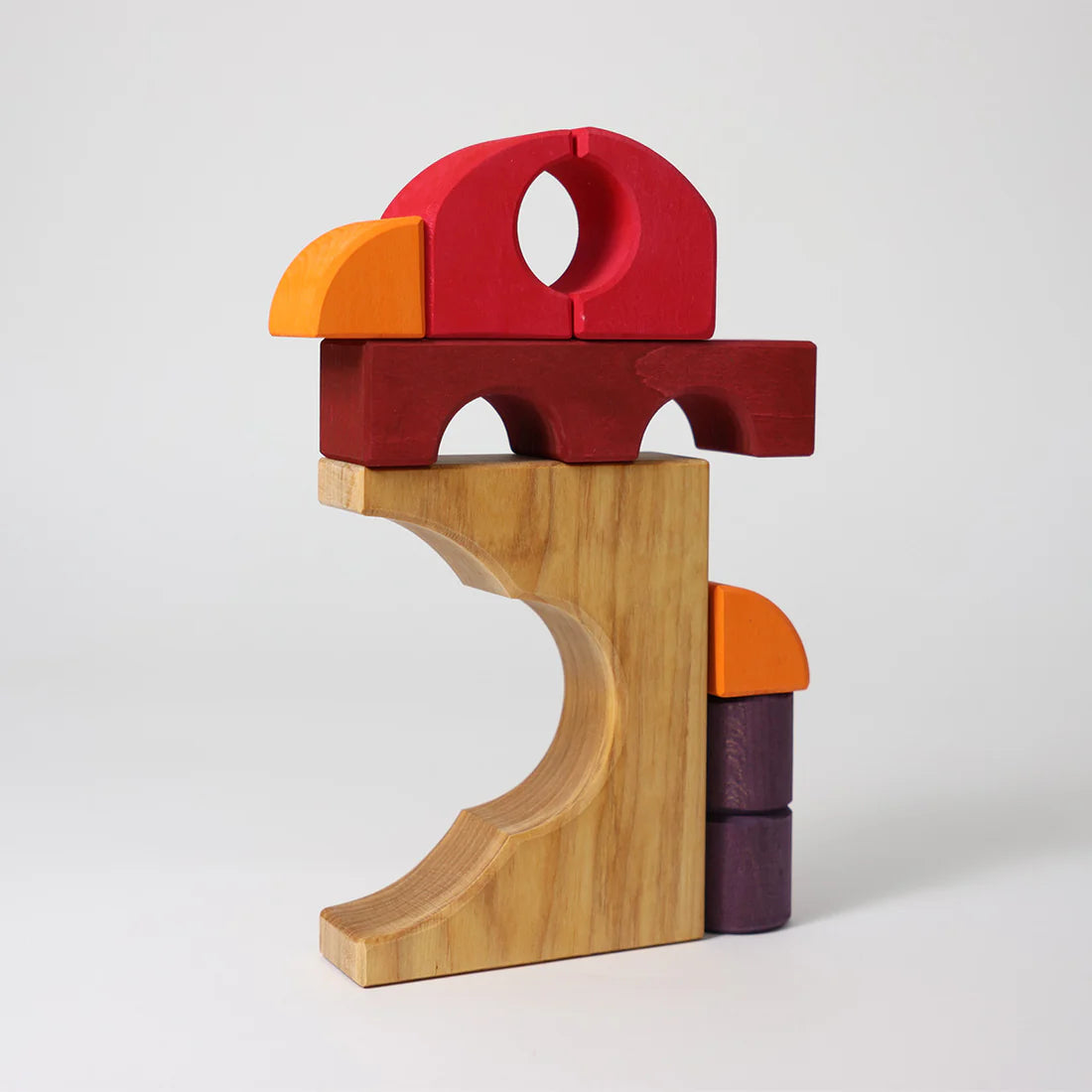 Grimm's Red Building Set with large red wooden blocks for creative building and open-ended imaginative play.