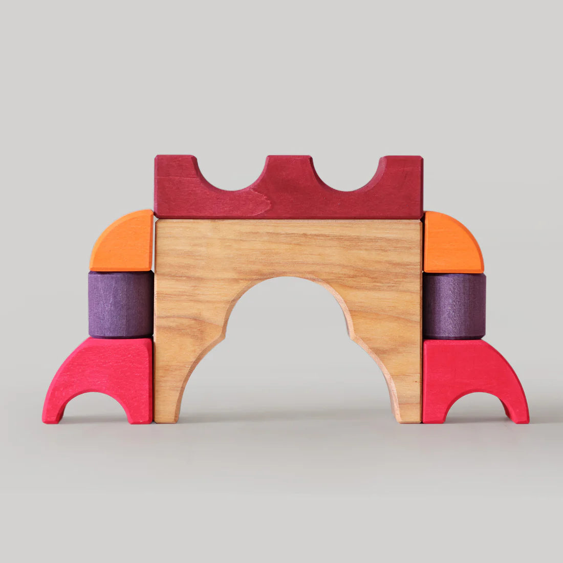 Grimm's Red Building Set with large red wooden blocks for creative building and open-ended imaginative play.
