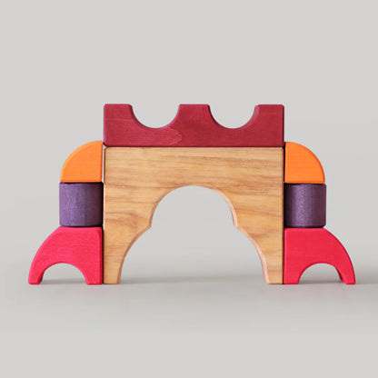 Grimm's Red Building Set with large red wooden blocks for creative building and open-ended imaginative play.