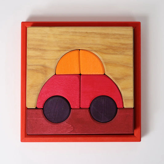 Grimm's Red Building Set with large red wooden blocks for creative building and open-ended imaginative play.