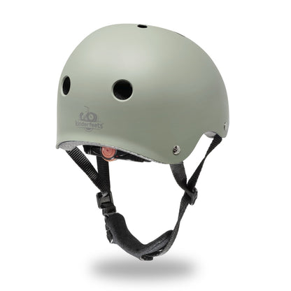 Green helmet with black straps on a white background